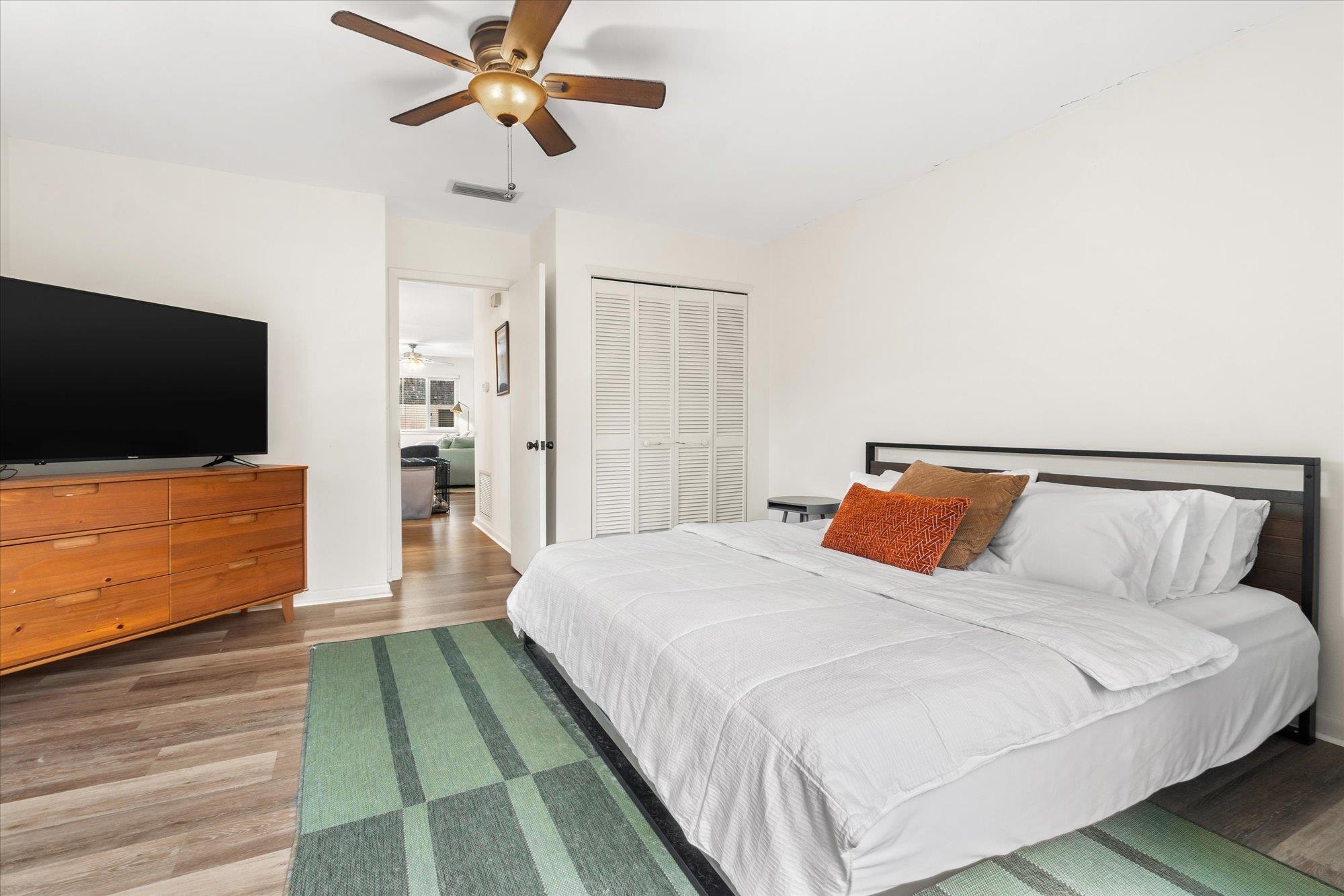 216 9th Street St. Augustine, FL 32080 - Photo 11 of 35 a bedroom with a bed and a flat screen tv