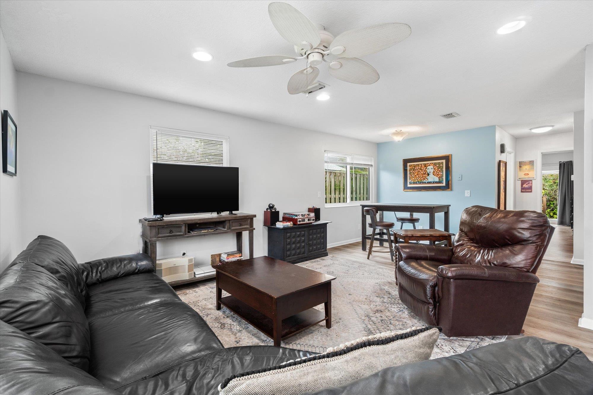 216 9th Street St. Augustine, FL 32080 - Photo 19 of 35 a living room with furniture and a flat screen tv