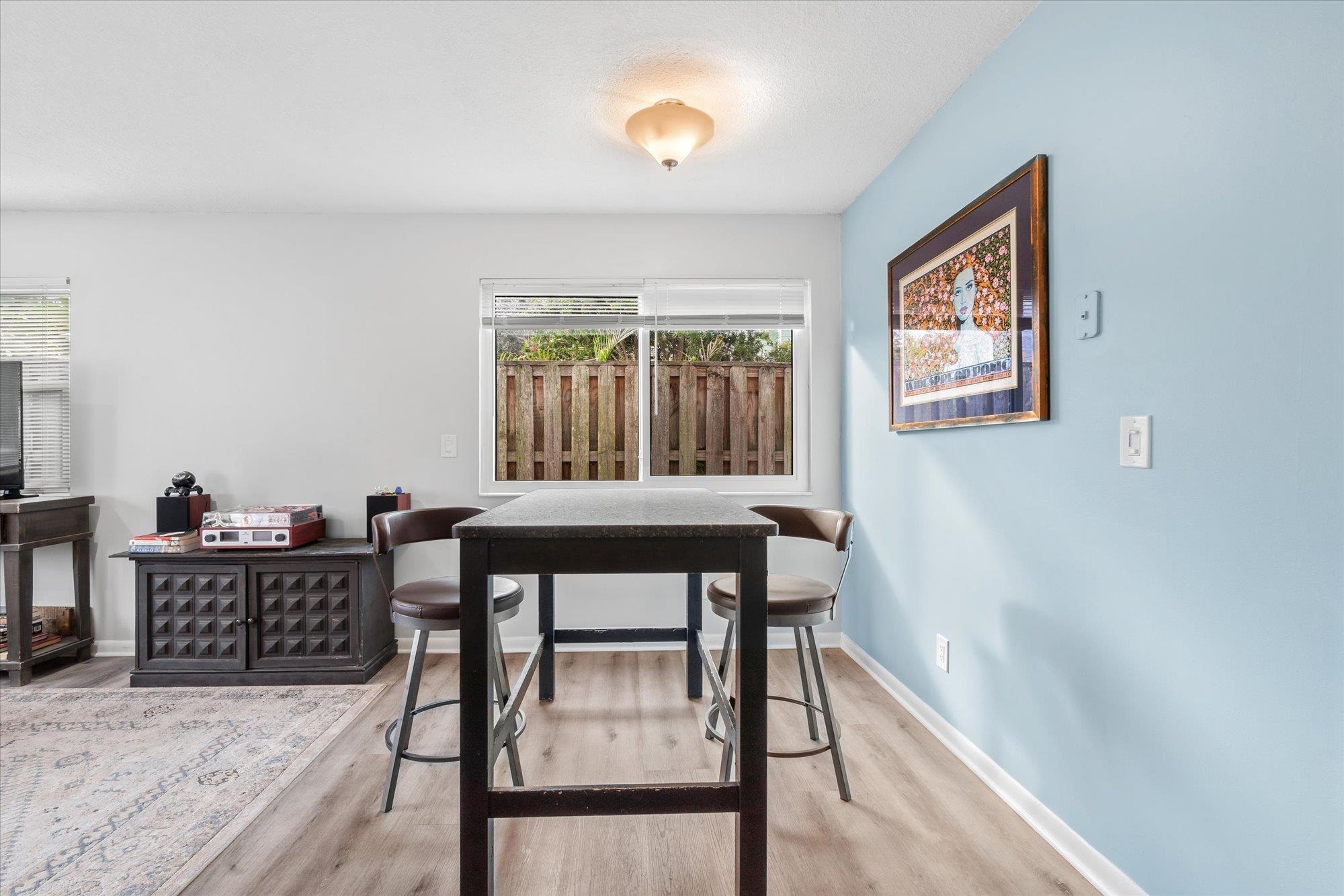 216 9th Street St. Augustine, FL 32080 - Photo 21 of 35 a view of a workspace with furniture and a window