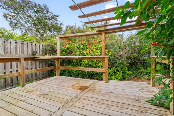 a view of backyard with wooden deck and floor