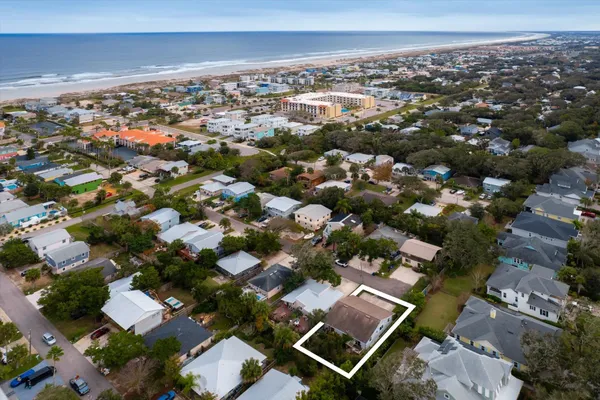 an aerial view of residential building with parking