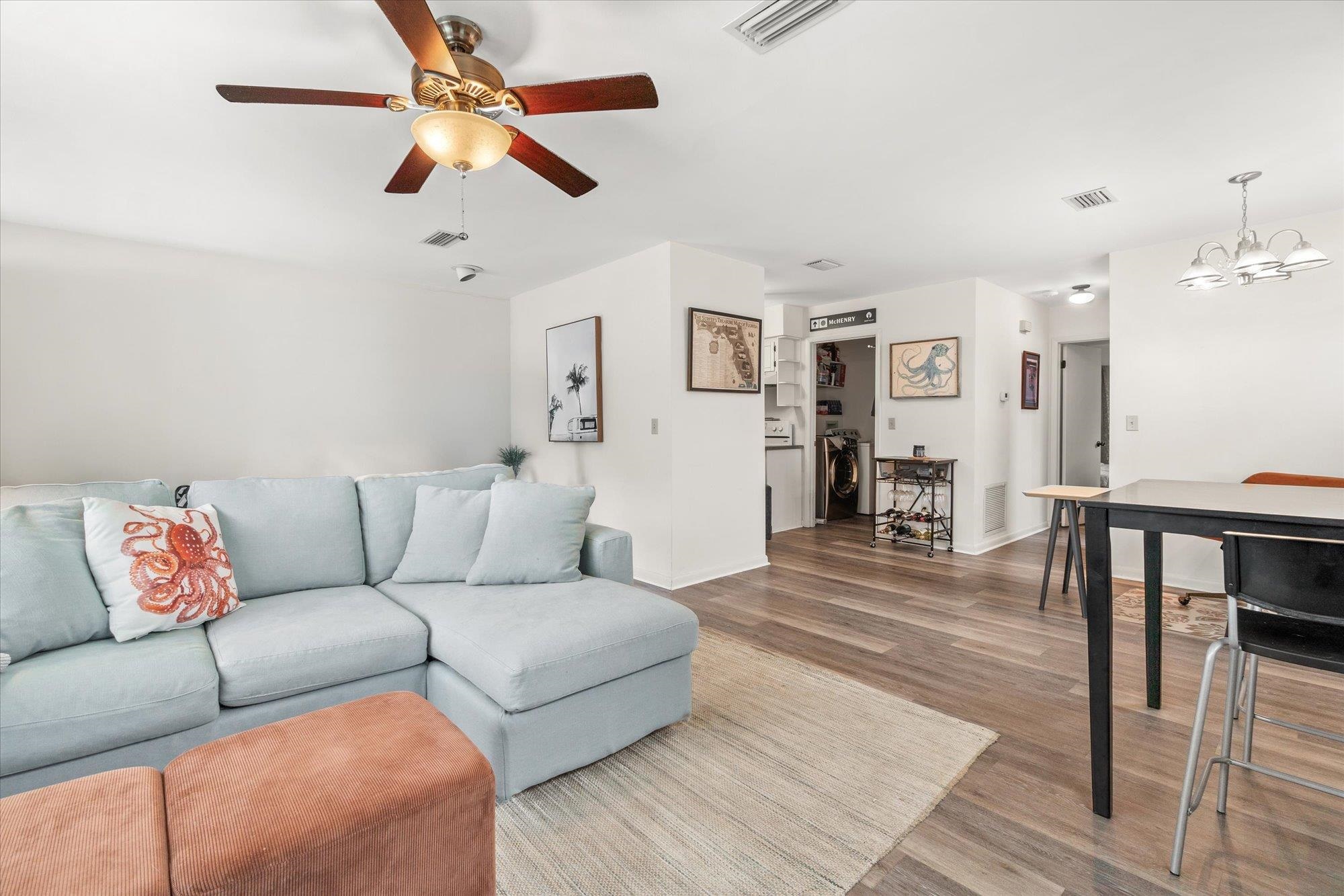 216 9th Street St. Augustine, FL 32080 - Photo 5 of 35 a living room with furniture and a wooden floor