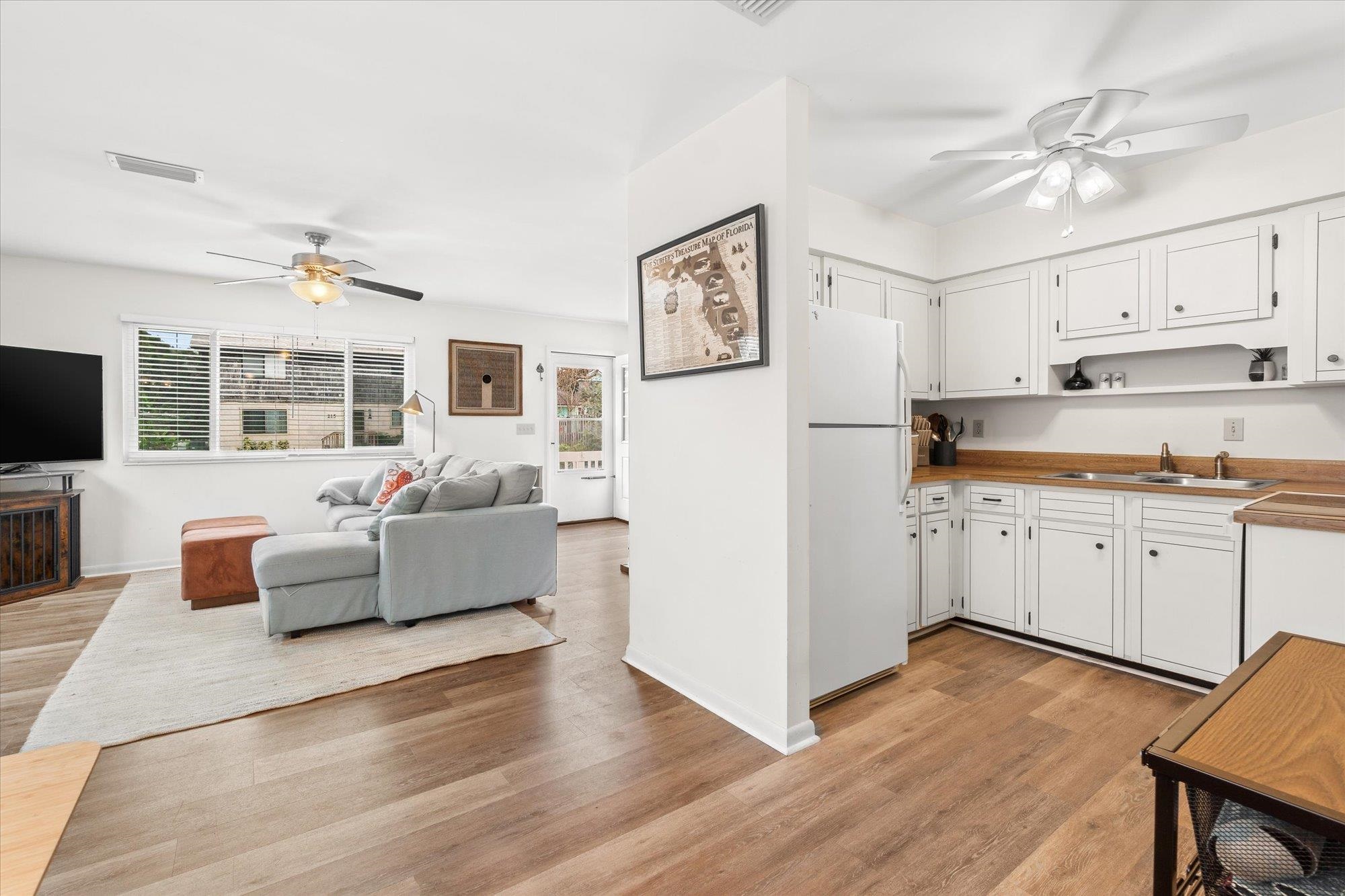 216 9th Street St. Augustine, FL 32080 - Photo 7 of 35 a view of kitchen with cabinets and wooden floor
