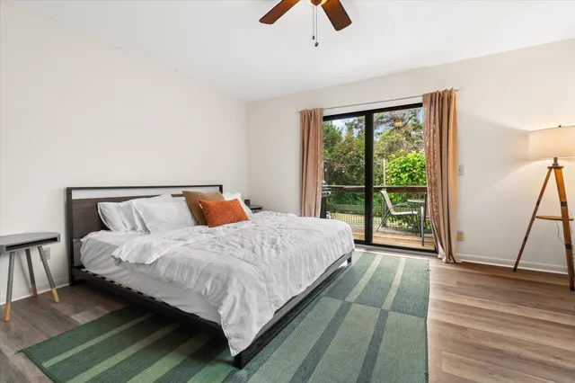 a bed sitting in a bedroom next to a window