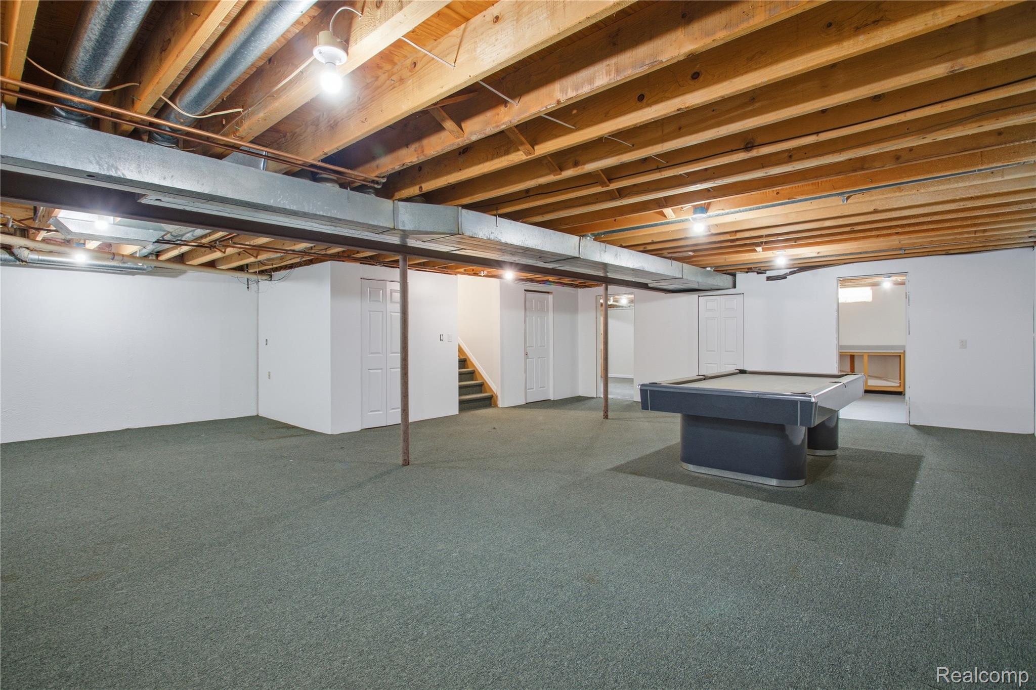 52658 Stag Ridge Drive Macomb, MI 48042 - Photo 28 of 28 Spacious lower level featuring exposed wood joists and an open-plan layout