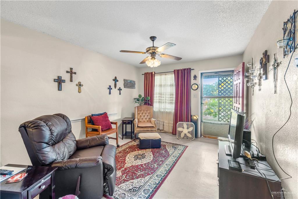 202 North Ester Street Edcouch, TX 78538 - Photo 3 of 13 a living room with furniture and a large window
