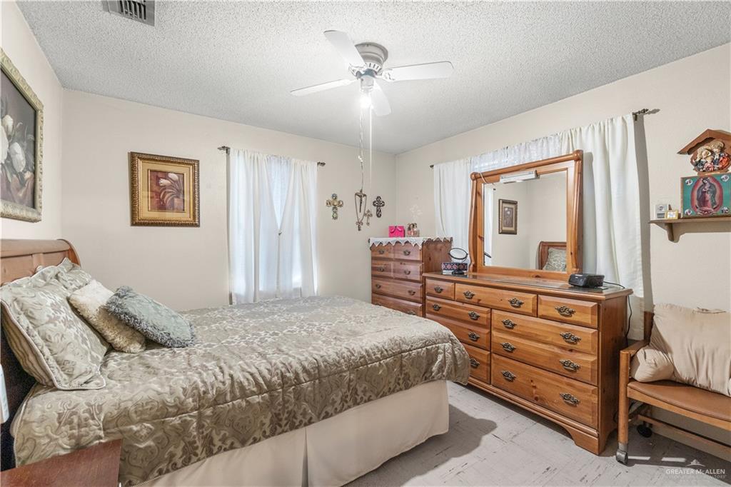 202 North Ester Street Edcouch, TX 78538 - Photo 6 of 13 a bedroom with a bed and a dresser