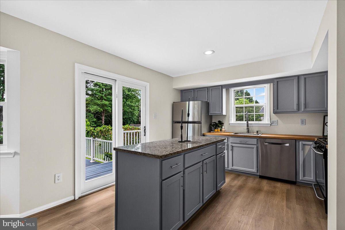 11057 Bishopsgate Court Reston, VA 20194 - Photo 20 of 72 Kitchen Access to the Tiered Deck, Pool, & Backyar
