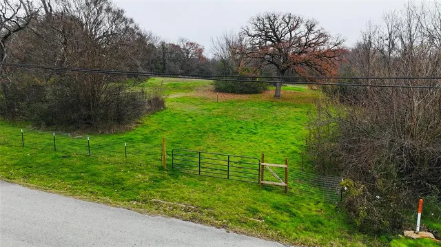 a view of swimming pool with a yard