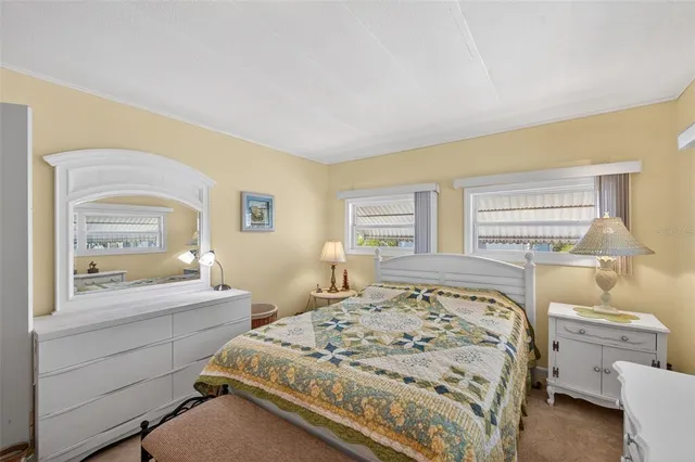 a bathroom with a granite countertop sink a large mirror and a shower
