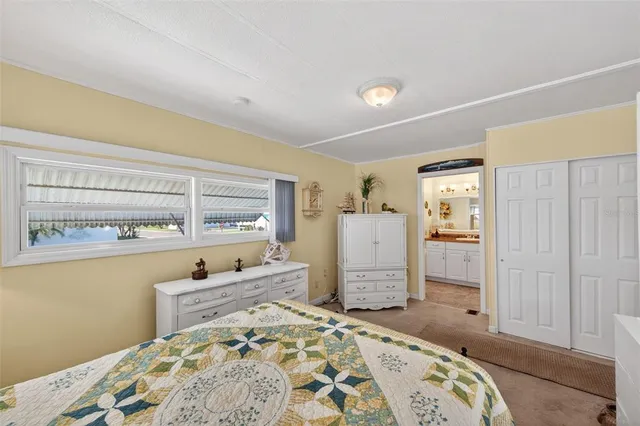 a bathroom with a granite countertop sink a mirror and a shower