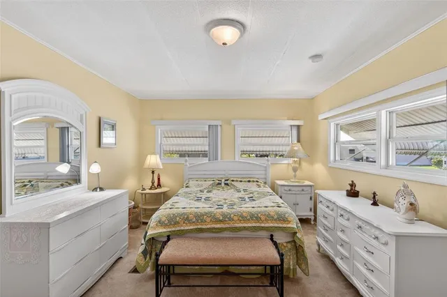 a bedroom with a bed and a lamp