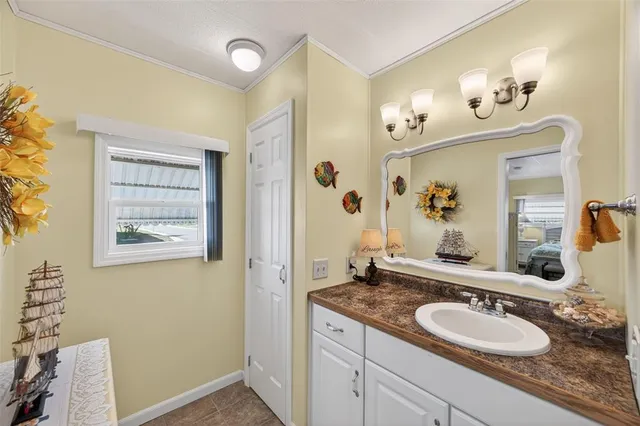 a bedroom with a bed and a lamp