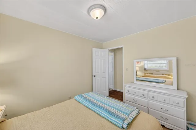 a room with gym equipment and potted plant