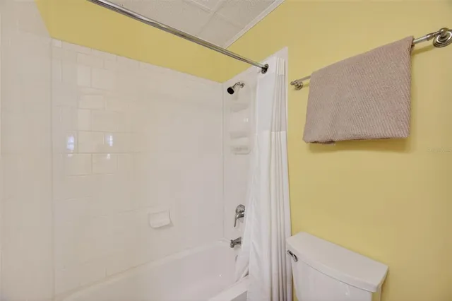 a view of a chair and table in the patio