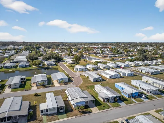 a view of a tennis ground with a large pool