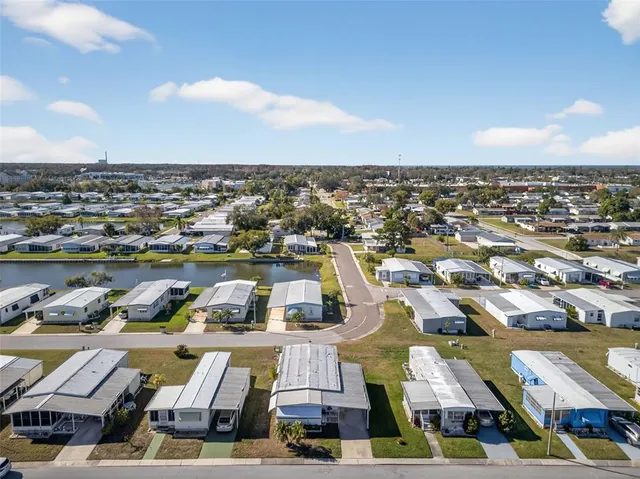 an aerial view of a house with swimming pool and porch