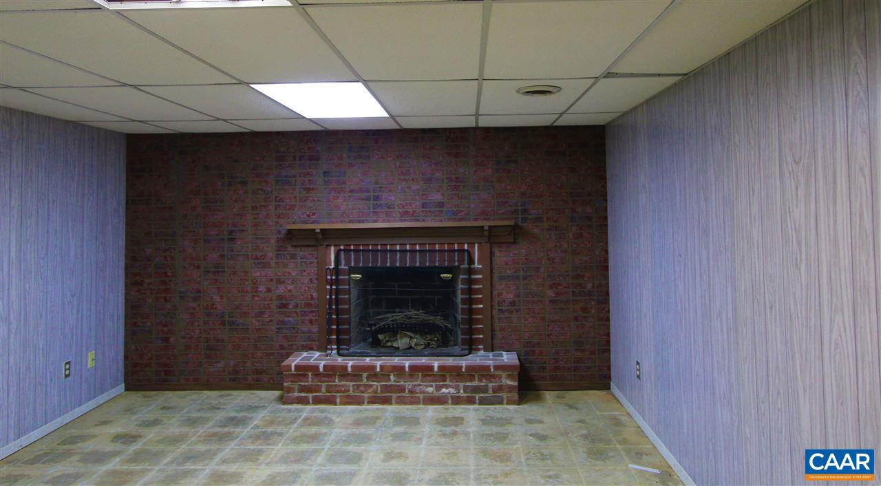 803 Woodlands Road Charlottesville, VA 22901 - Photo 13 of 15 a living room with a fireplace