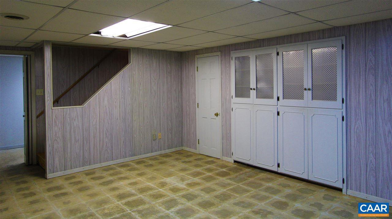 803 Woodlands Road Charlottesville, VA 22901 - Photo 15 of 15 a view of an empty room with wooden door