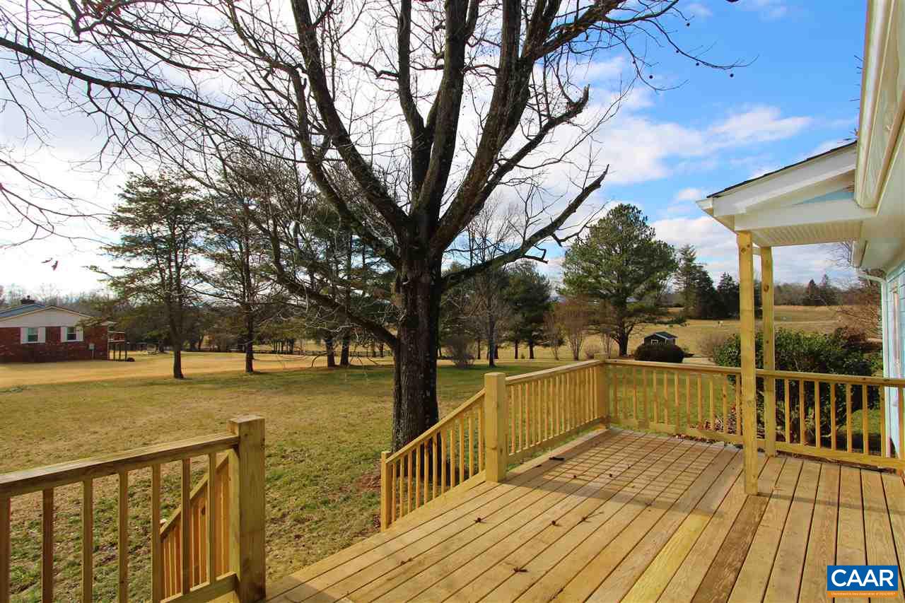 803 Woodlands Road Charlottesville, VA 22901 - Photo 10 of 15 a view of balcony with wooden floor and trees