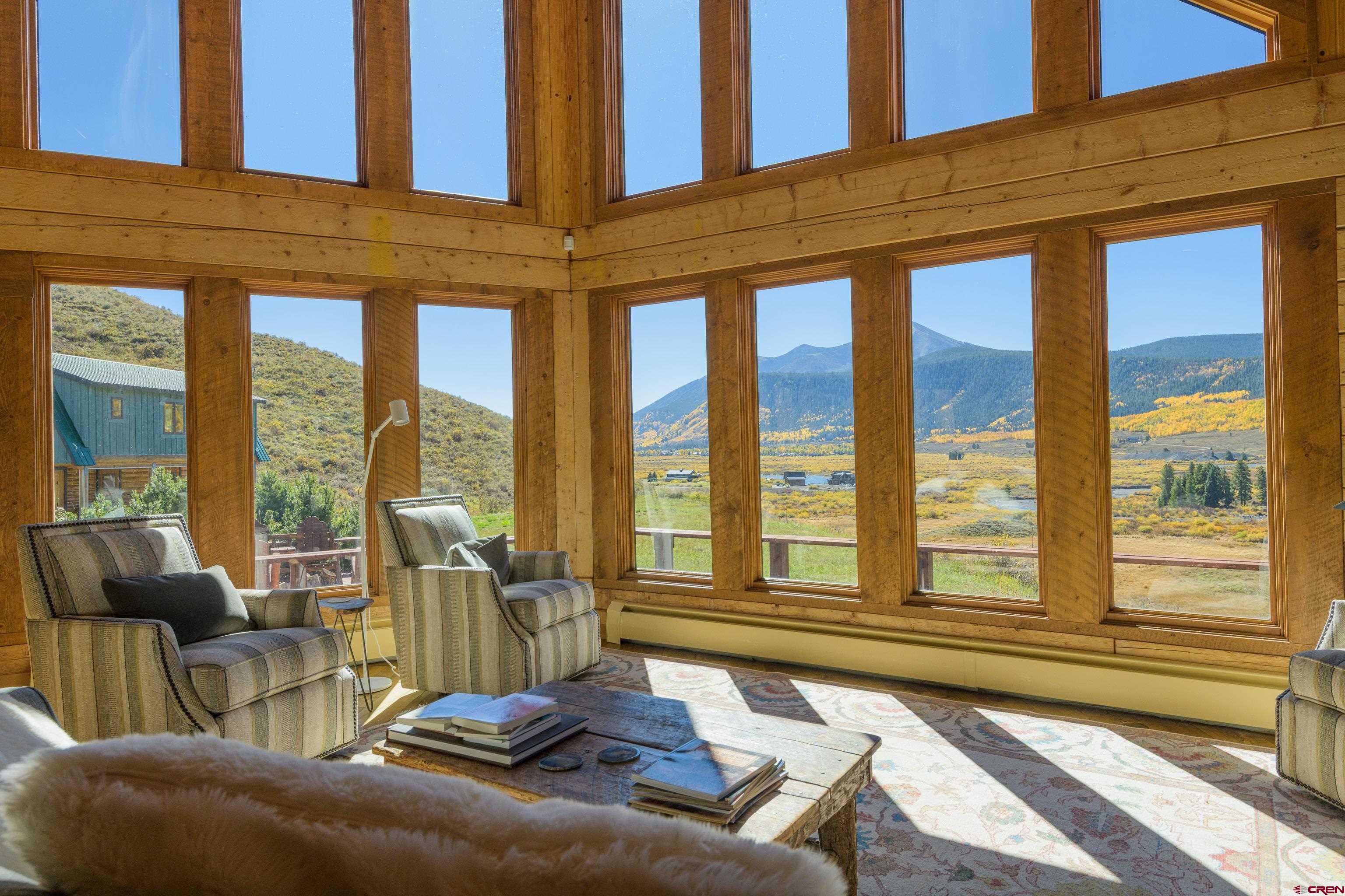 1250 County Road 734 Crested Butte, CO 81224 - Photo 13 of 45 a living room with furniture and large windows