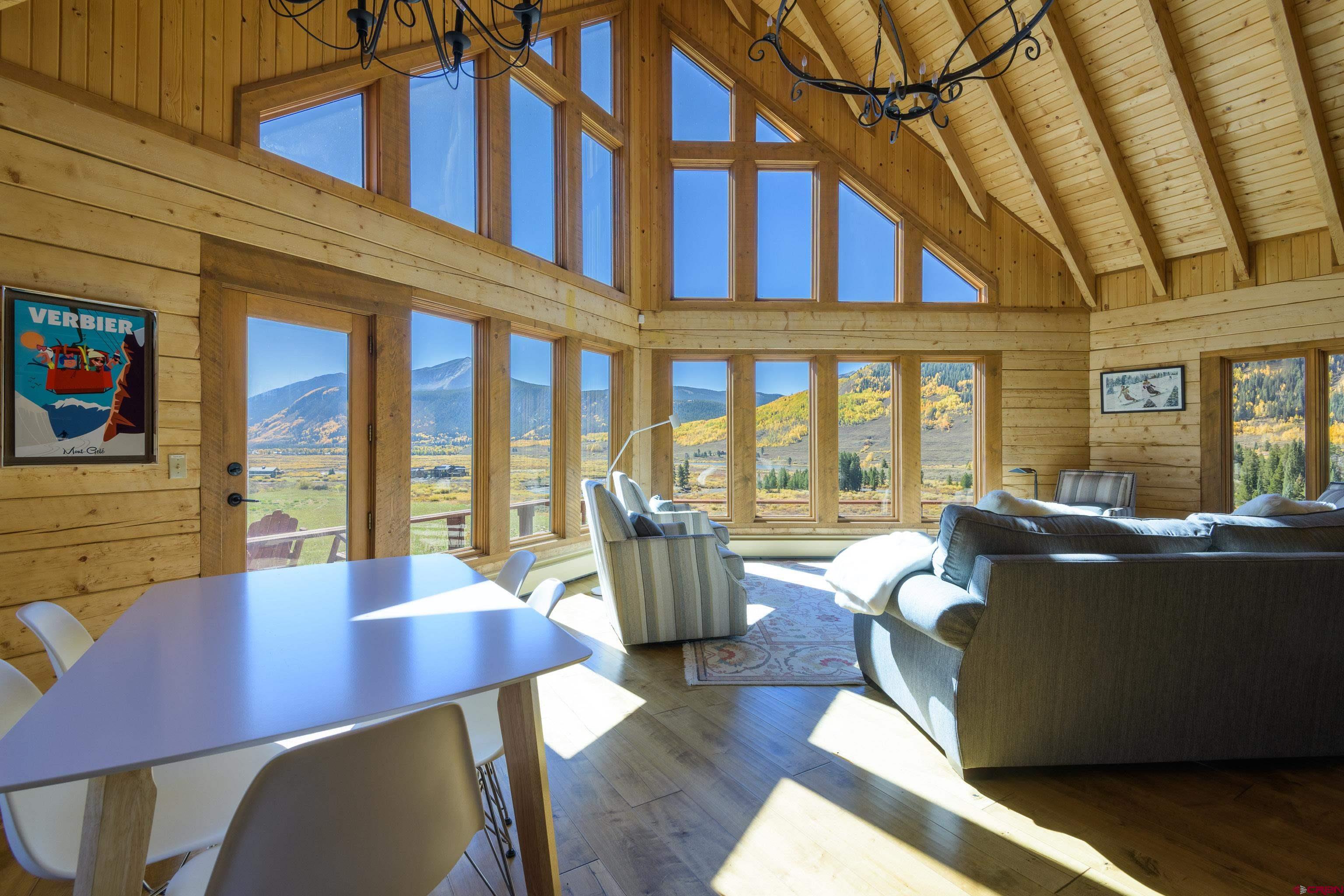 1250 County Road 734 Crested Butte, CO 81224 - Photo 14 of 45 a living room with furniture and floor to ceiling windows