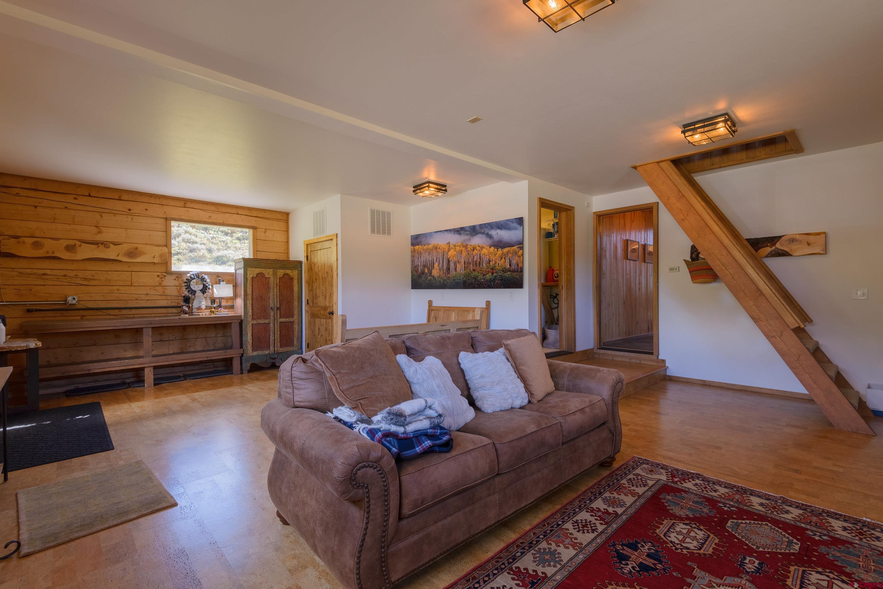 1250 County Road 734 Crested Butte, CO 81224 - Photo 21 of 45 a living room with furniture and wooden floor