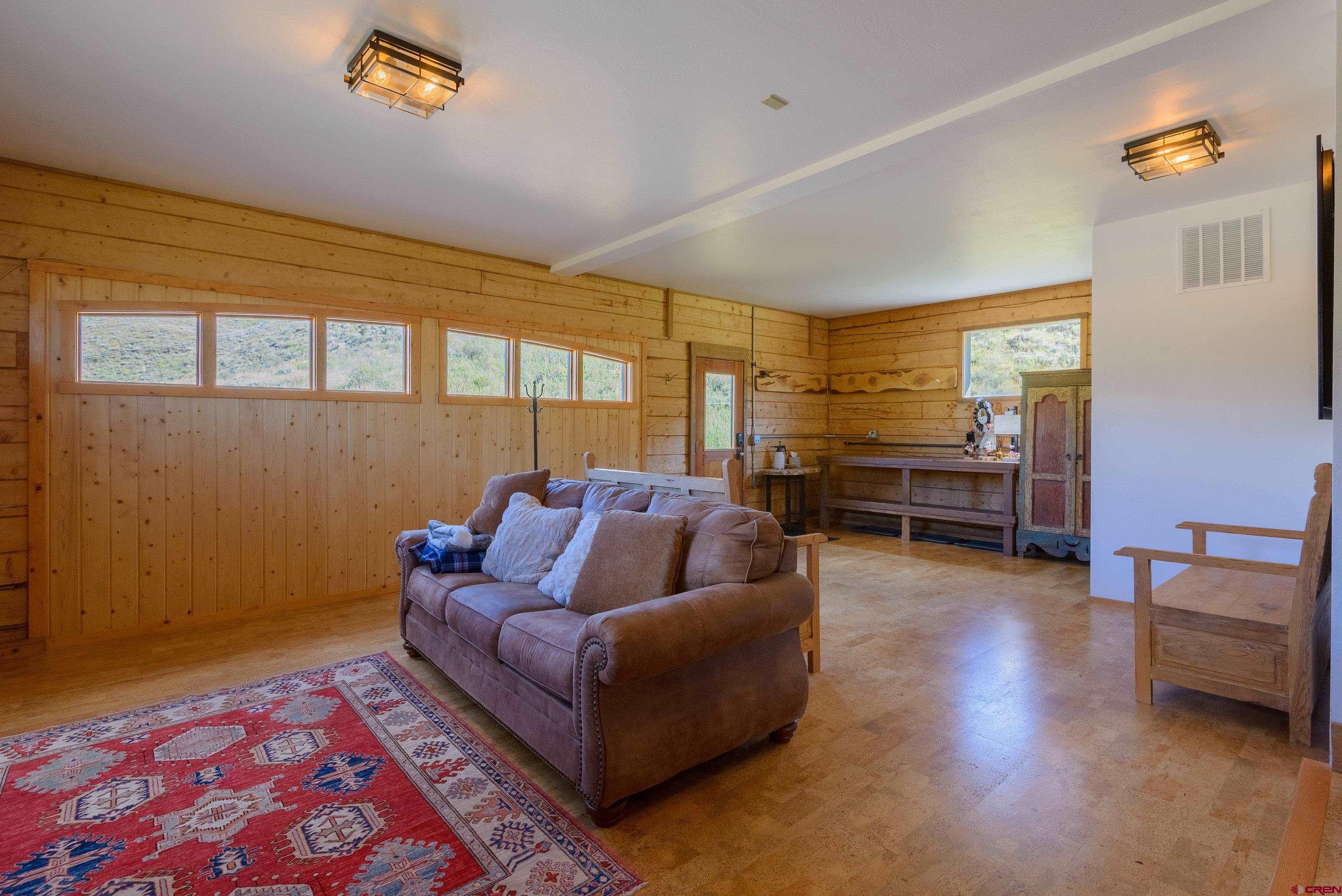 1250 County Road 734 Crested Butte, CO 81224 - Photo 22 of 45 a living room with furniture and a couch