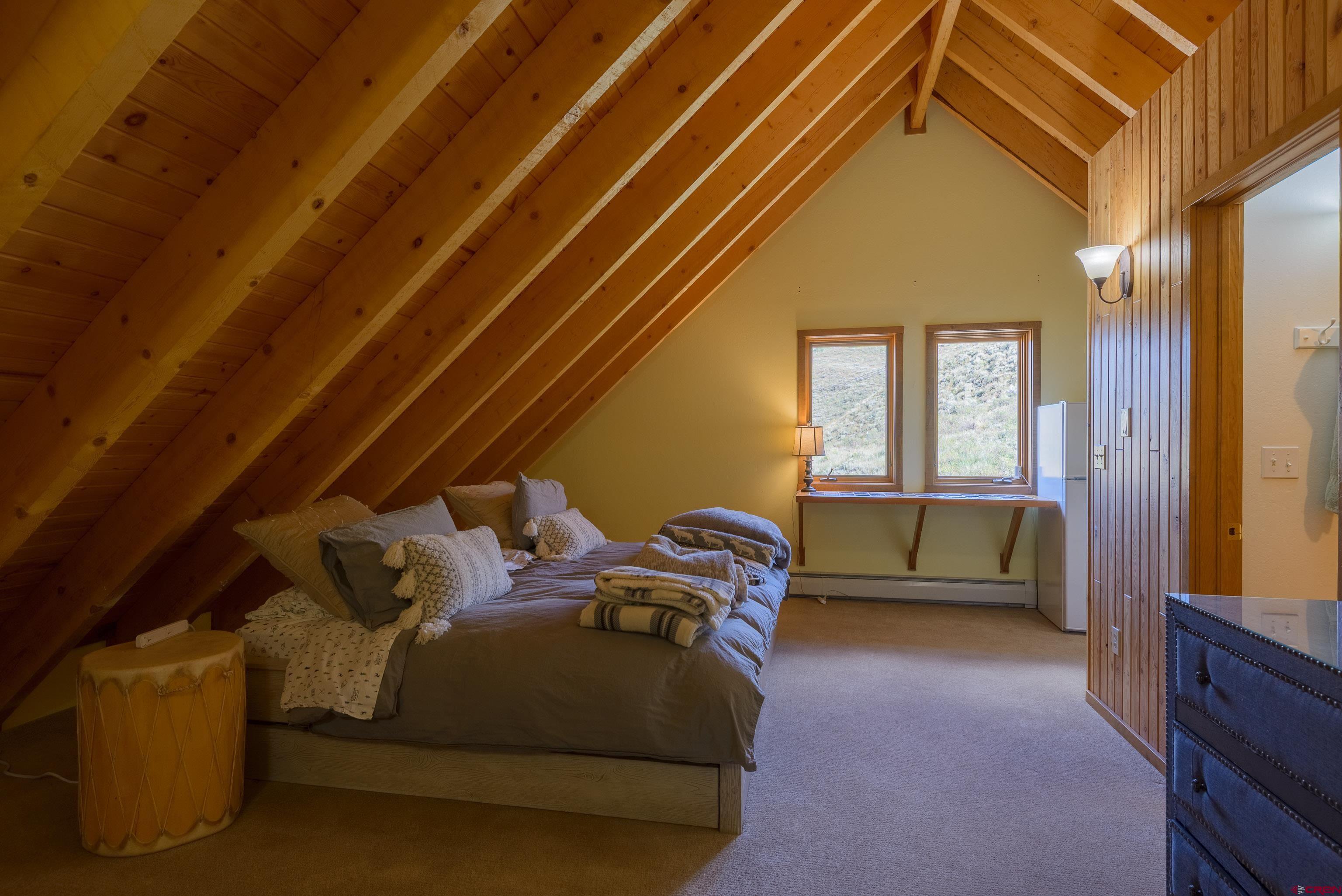 1250 County Road 734 Crested Butte, CO 81224 - Photo 23 of 45 a bed room with a bed and a window