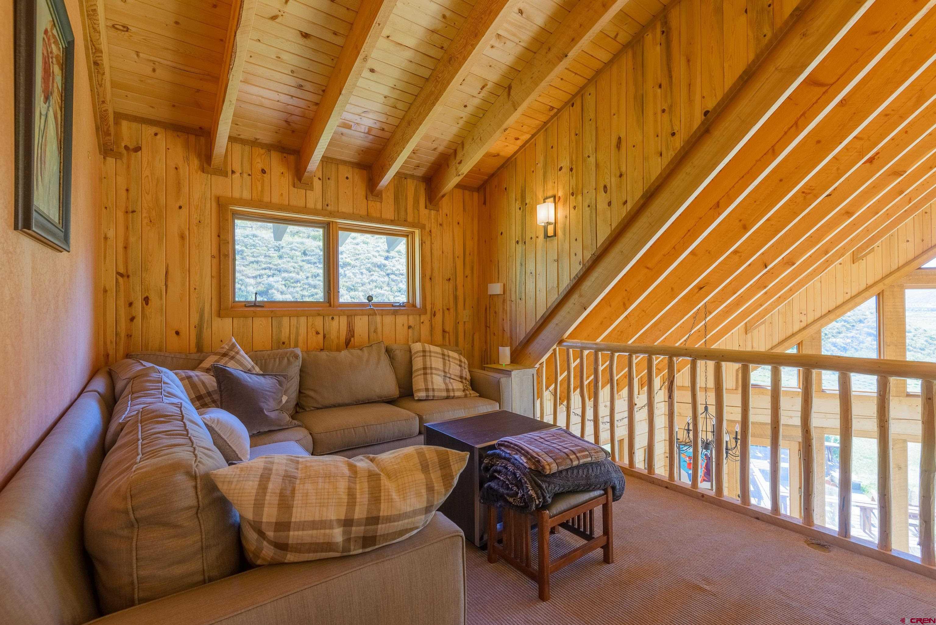 1250 County Road 734 Crested Butte, CO 81224 - Photo 25 of 45 a living room with furniture and a window
