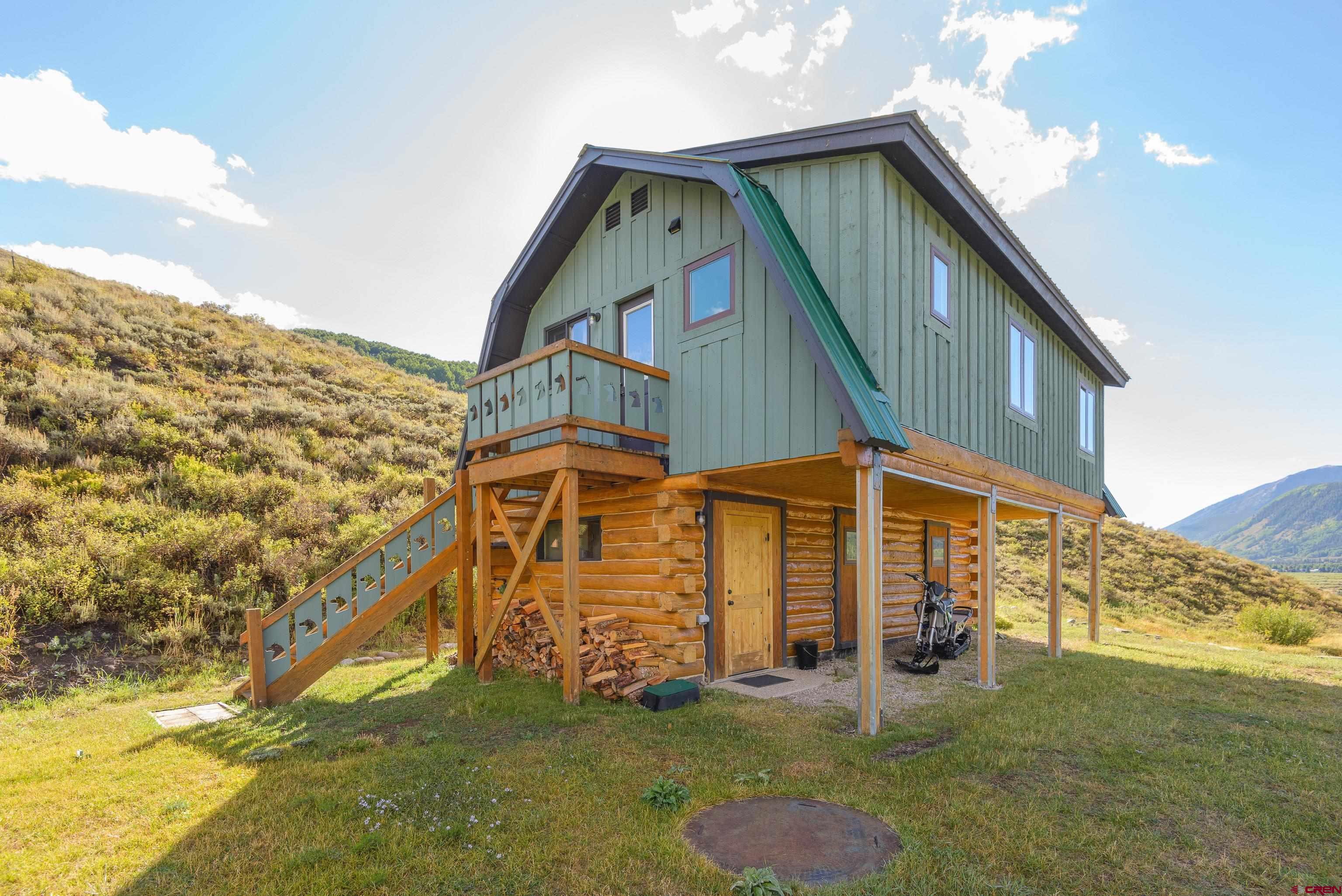 1250 County Road 734 Crested Butte, CO 81224 - Photo 36 of 45 a view of house with backyard