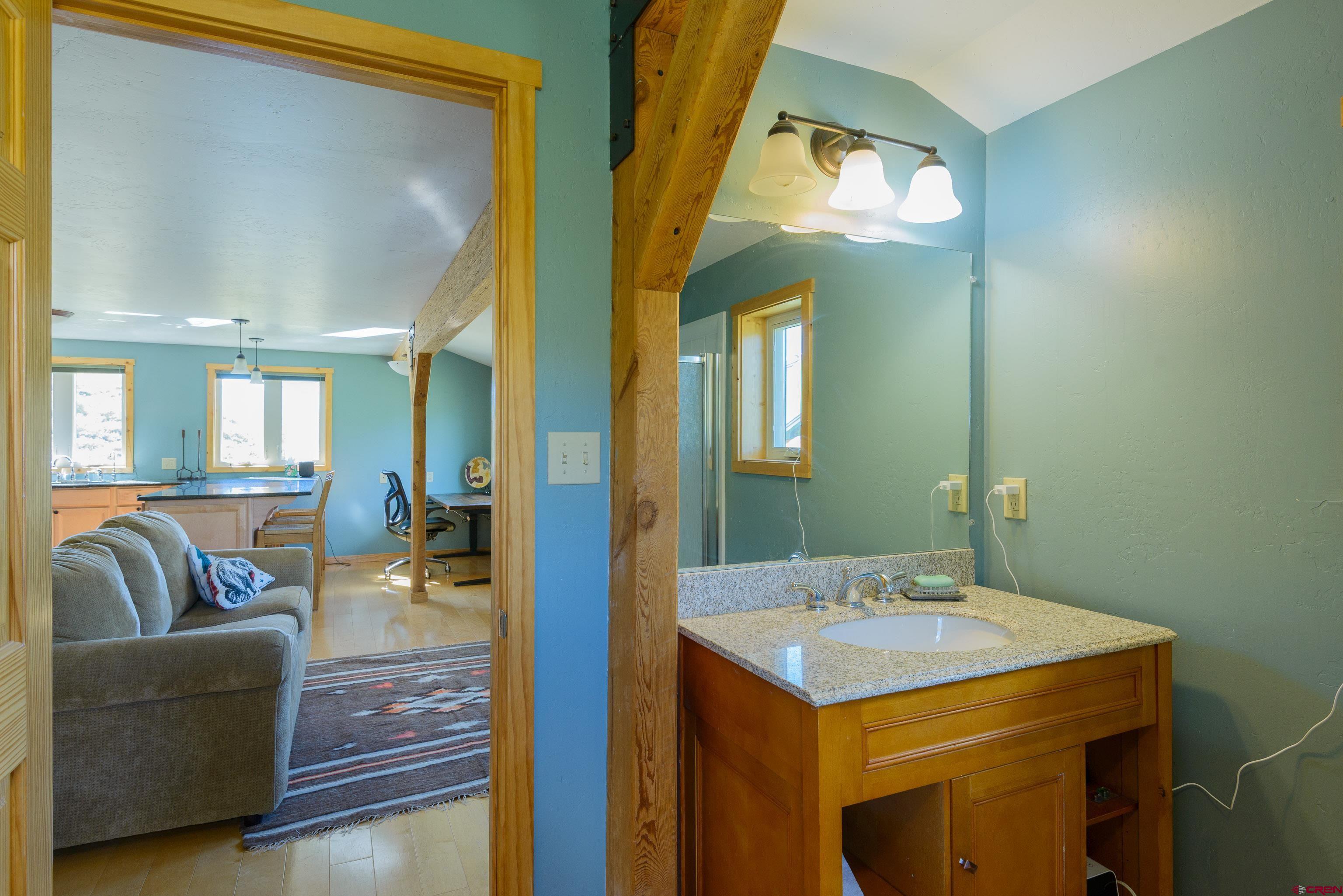 1250 County Road 734 Crested Butte, CO 81224 - Photo 43 of 45 a bathroom with a sink and a mirror