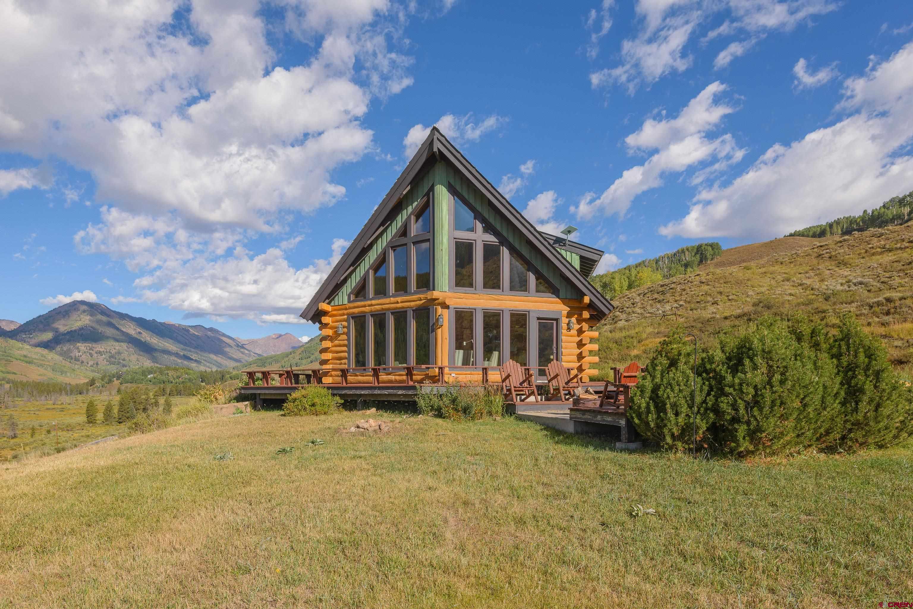 1250 County Road 734 Crested Butte, CO 81224 - Photo 44 of 45 a view of a house with a yard