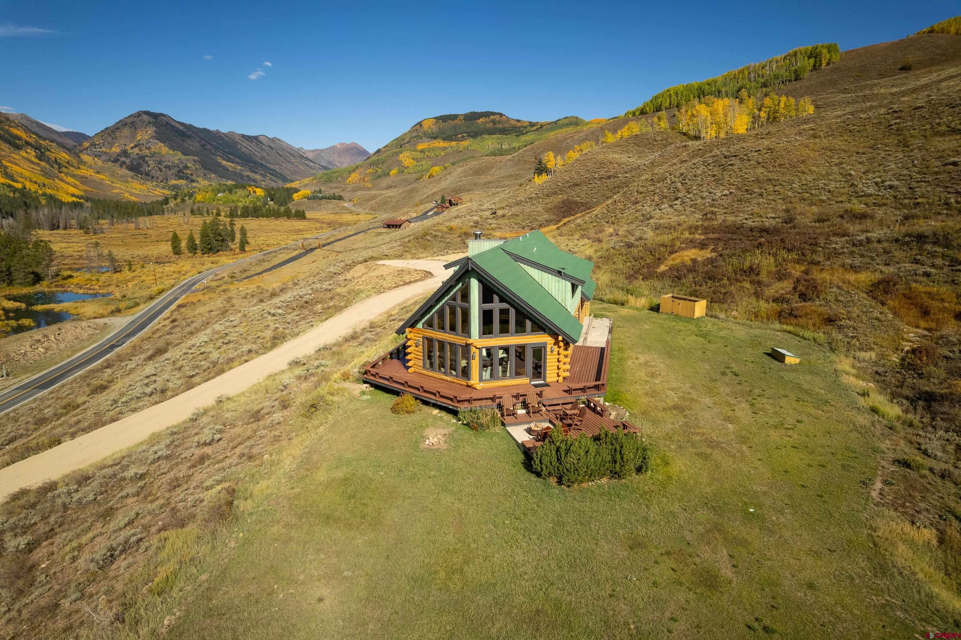 1250 County Road 734 Crested Butte, CO 81224 - Photo 7 of 45 a house with a mountain in the background
