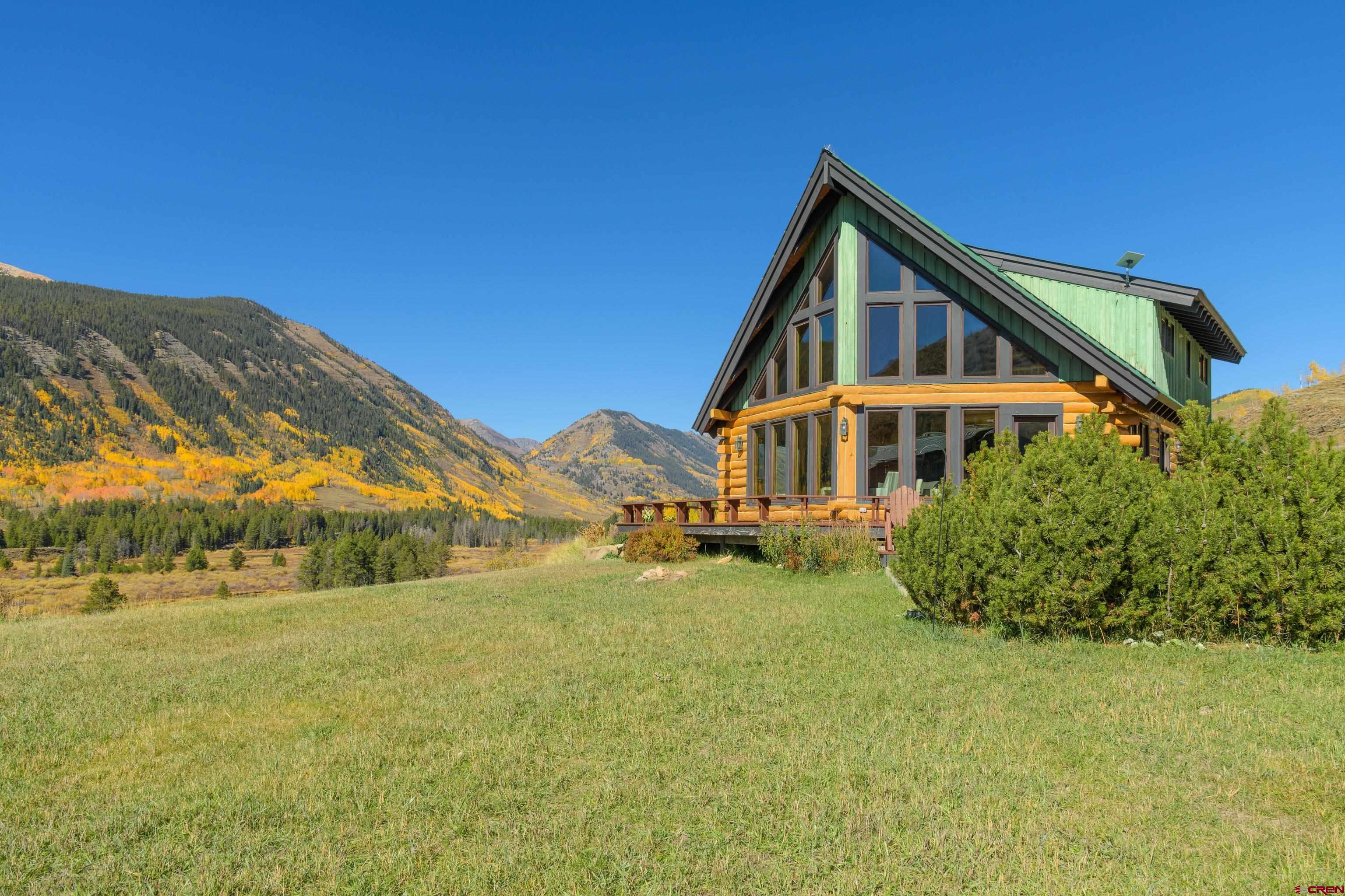 1250 County Road 734 Crested Butte, CO 81224 - Photo 8 of 45 a front view of a house with a yard