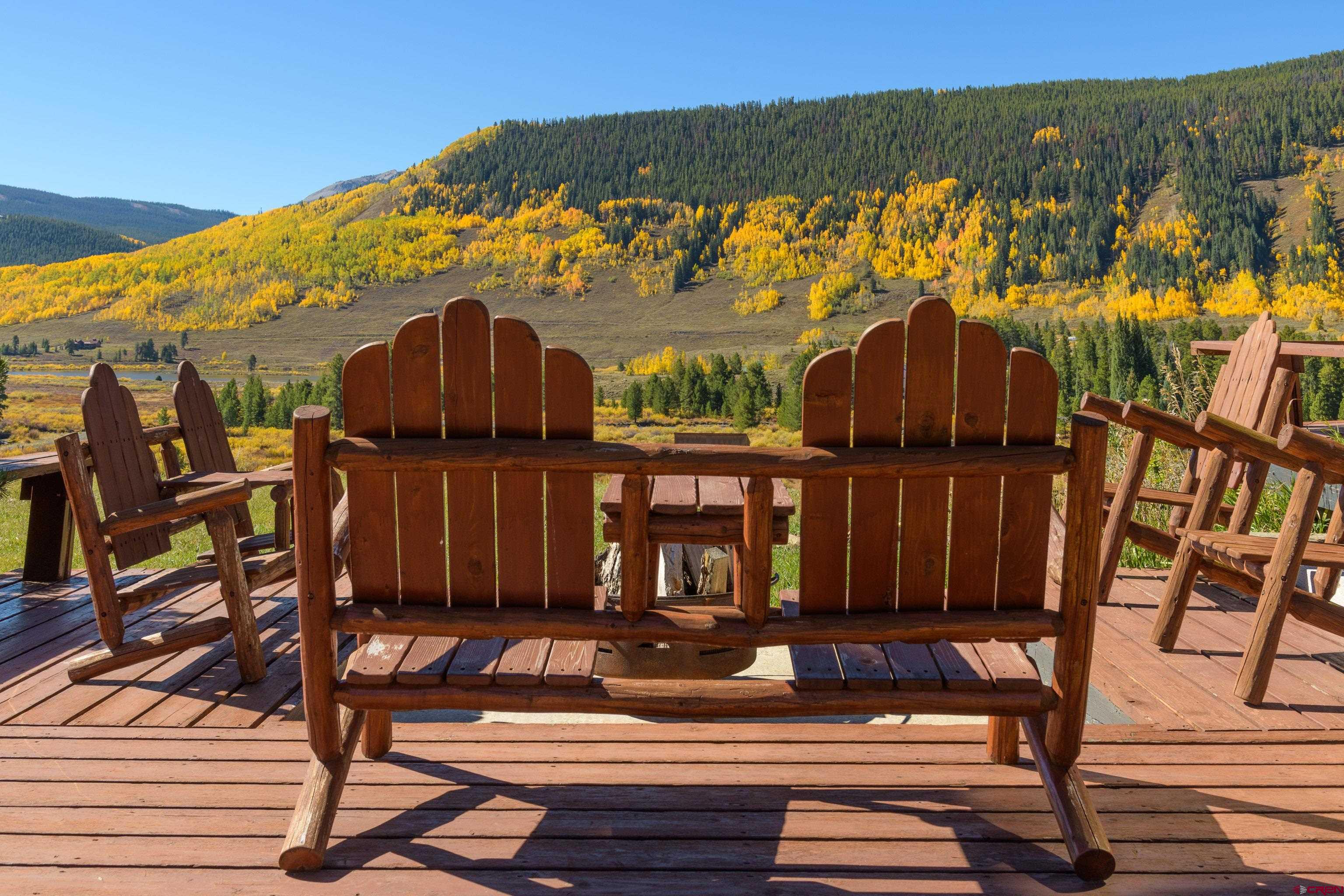 1250 County Road 734 Crested Butte, CO 81224 - Photo 9 of 45 a view of a house with wooden fence