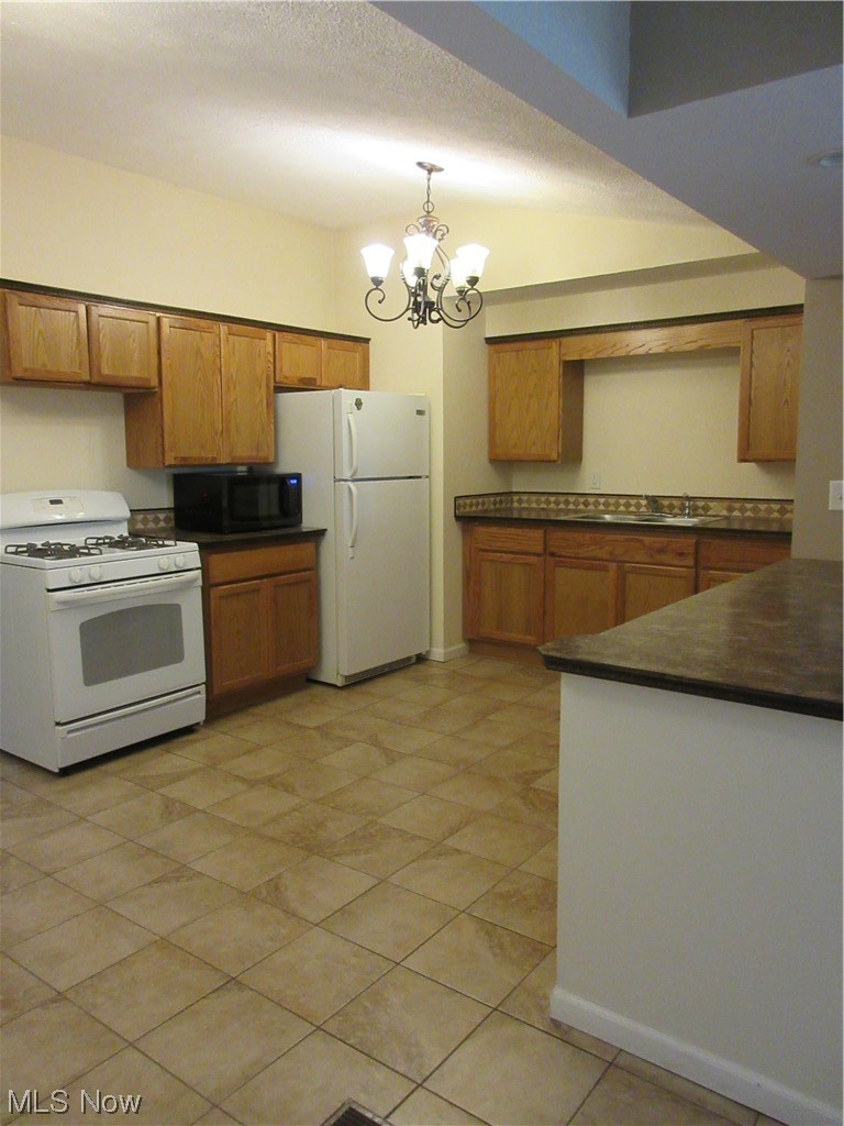 3104 Polly Road Ravenna, OH 44266 - Photo 10 of 23 Vast Eat In Kitchen Plenty of Cabinets and Counter Space Range, Fridge and Microwave Included