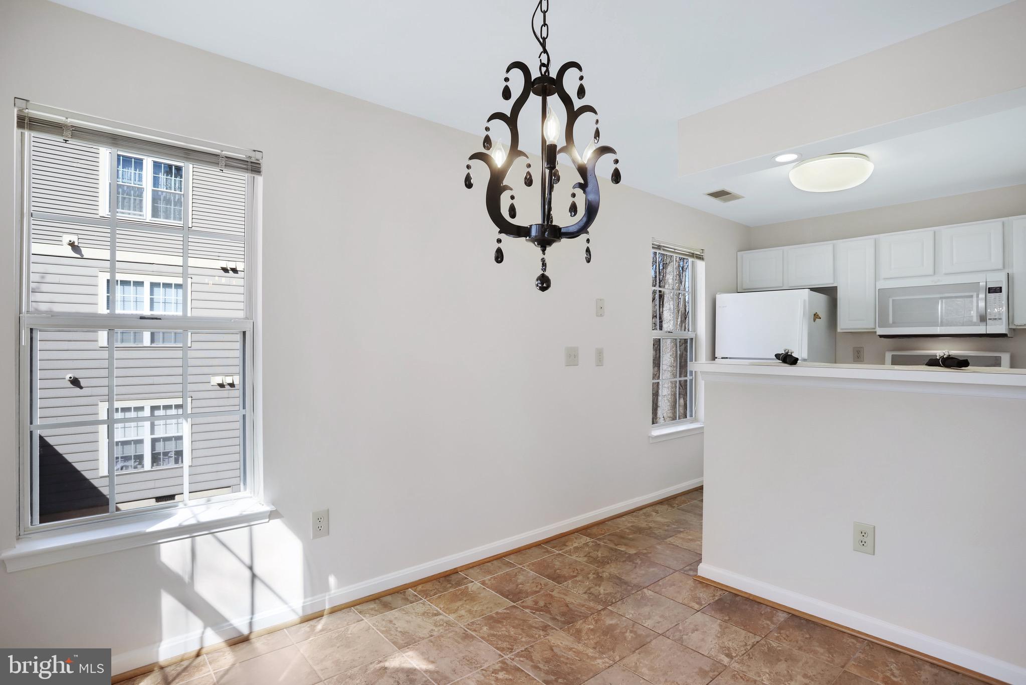 111 Timberbrook Lane, Unit 201 Gaithersburg, MD 20878 - Photo 13 of 38 a view of kitchen and front door