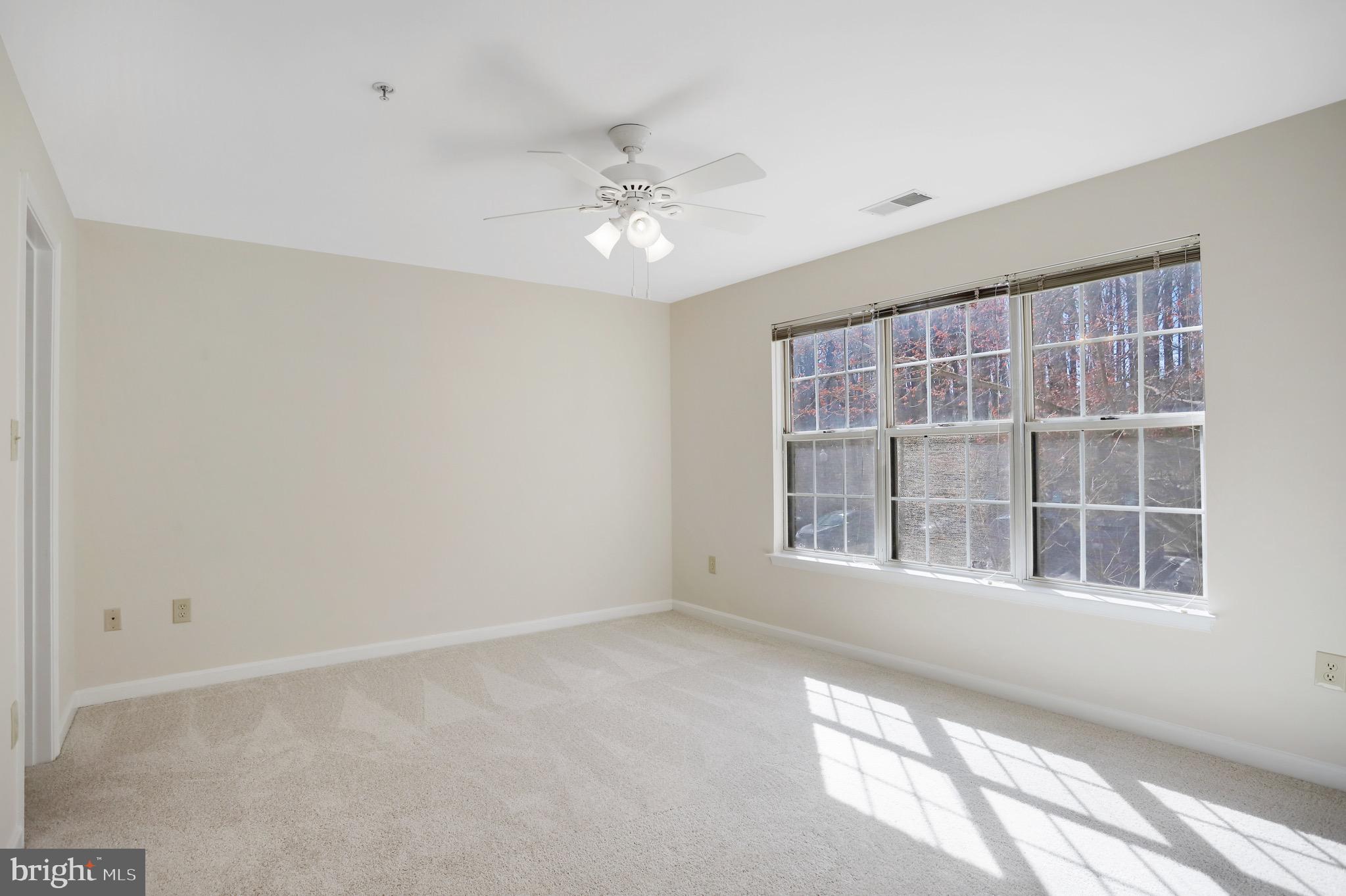 111 Timberbrook Lane, Unit 201 Gaithersburg, MD 20878 - Photo 20 of 38 a view of an empty room with a window