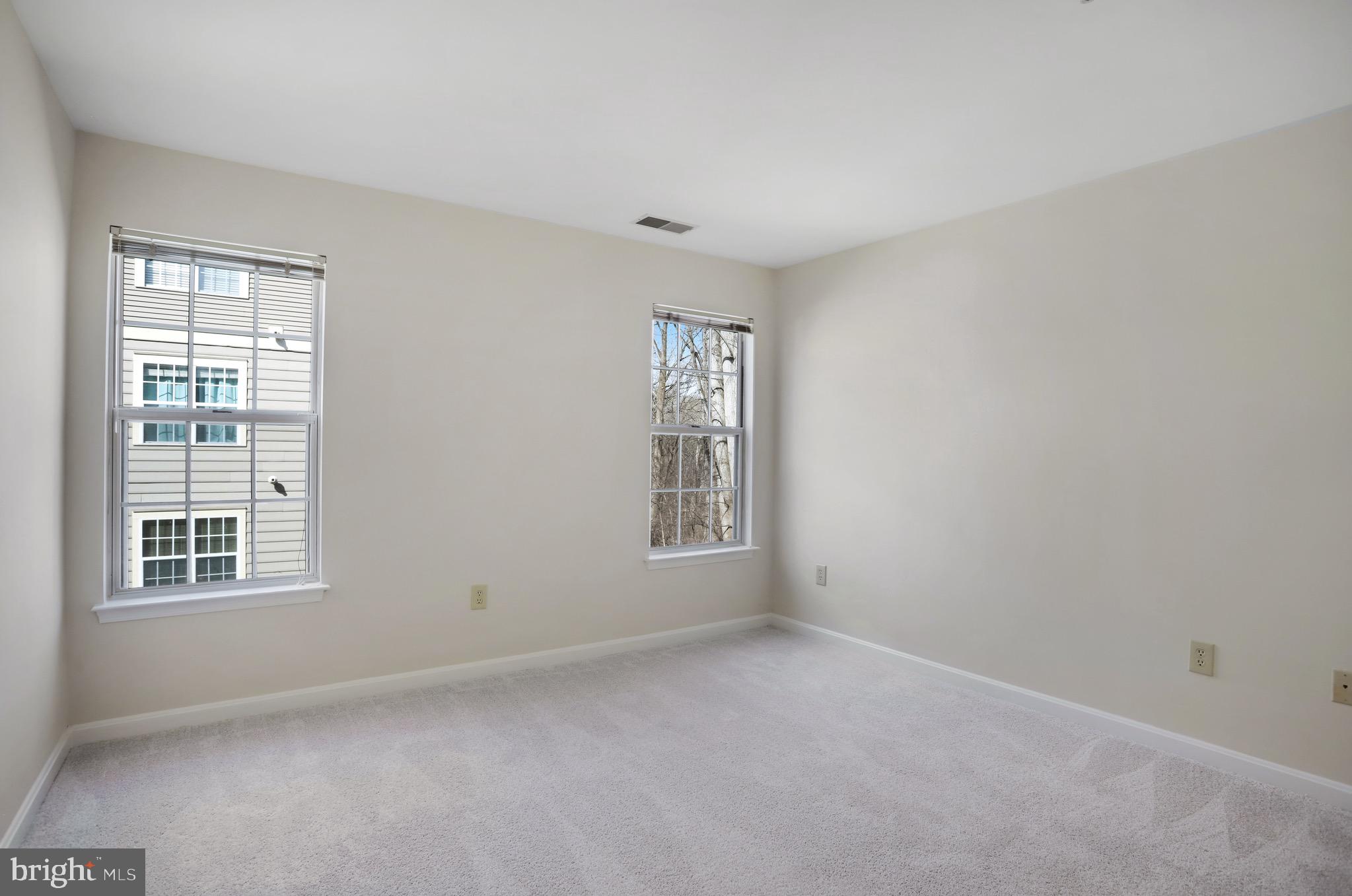 111 Timberbrook Lane, Unit 201 Gaithersburg, MD 20878 - Photo 26 of 38 an empty room with windows