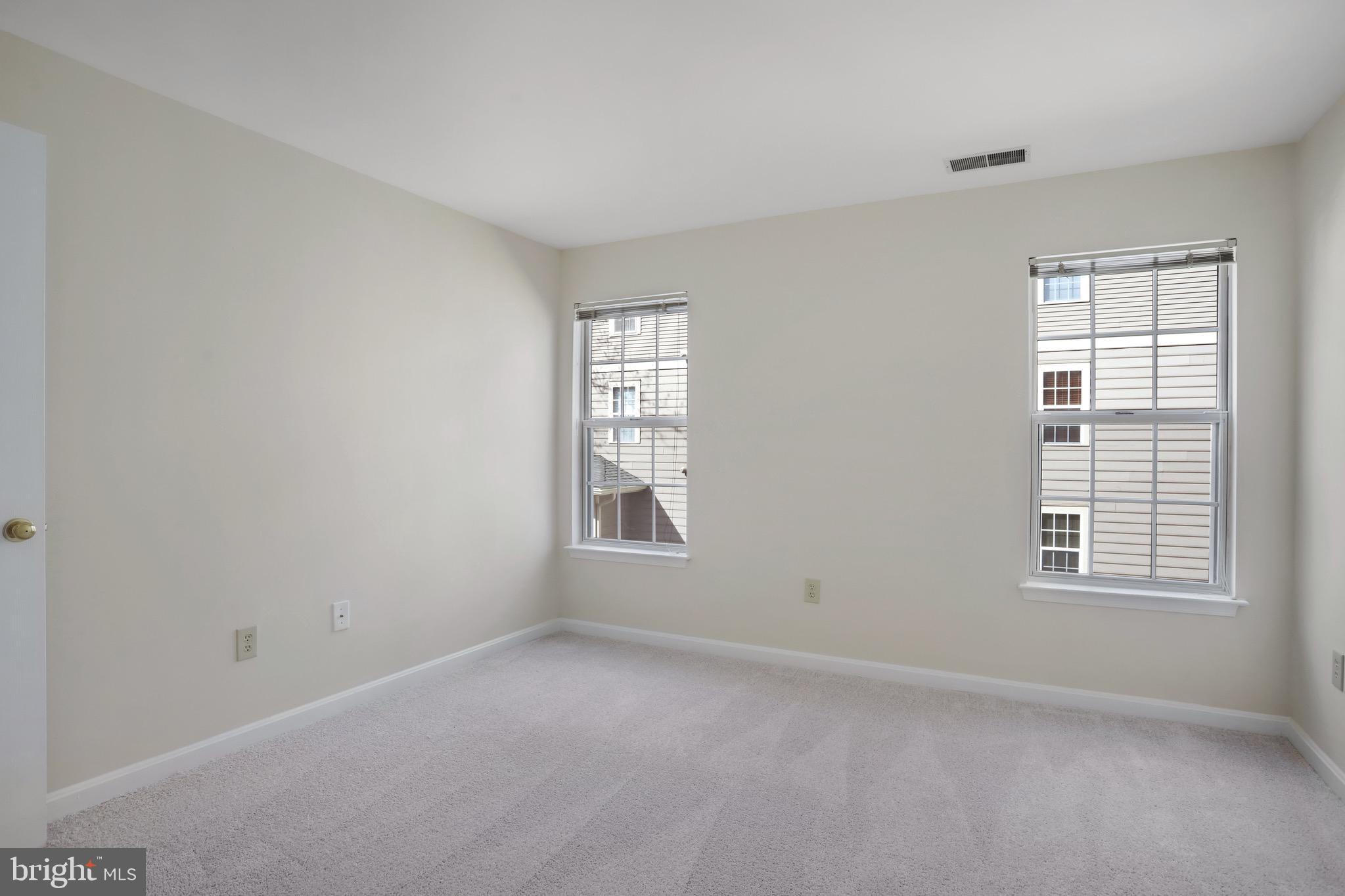 111 Timberbrook Lane, Unit 201 Gaithersburg, MD 20878 - Photo 28 of 38 an empty room with windows