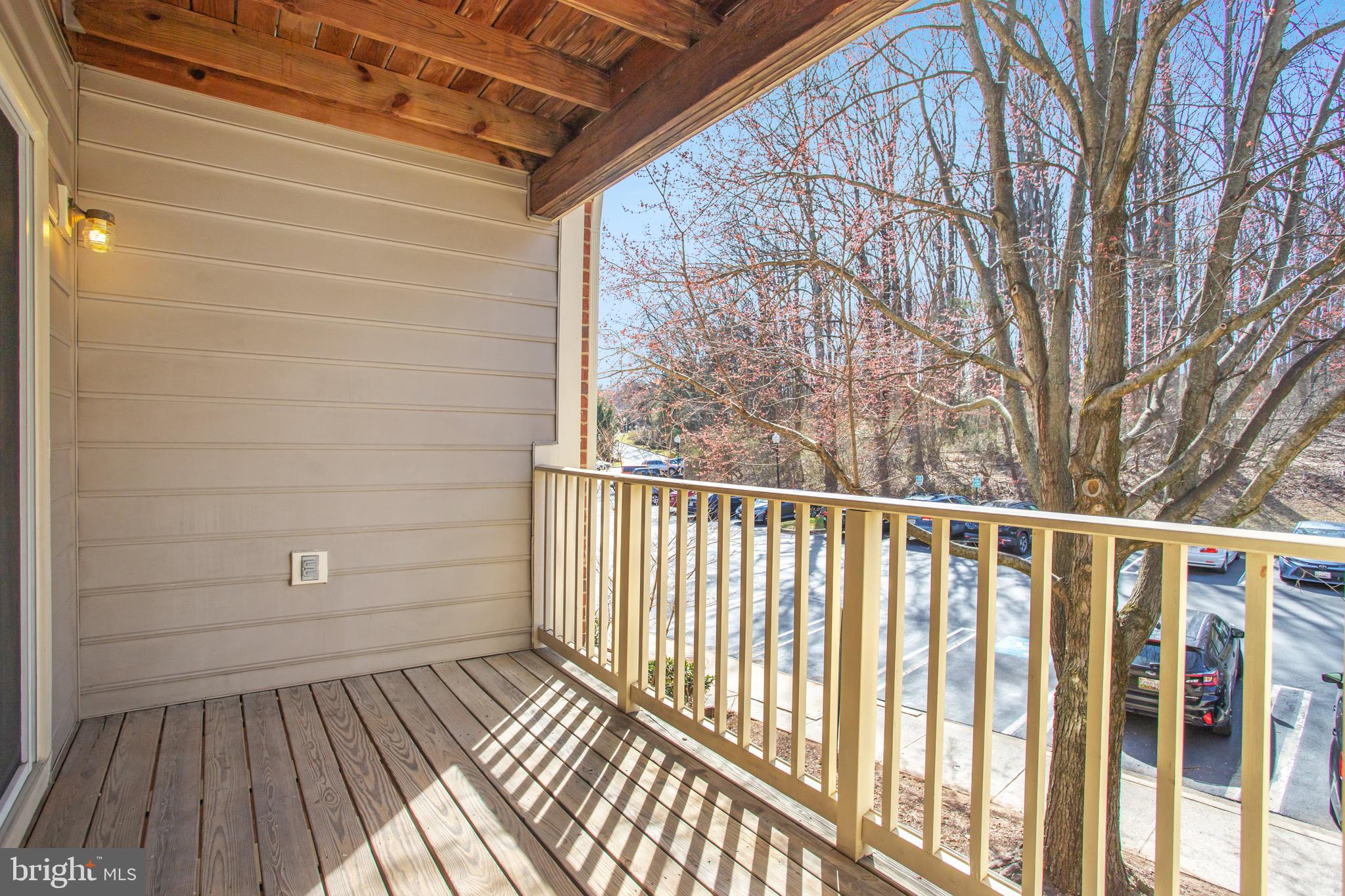 111 Timberbrook Lane, Unit 201 Gaithersburg, MD 20878 - Photo 34 of 38 a view of a balcony with wooden floor