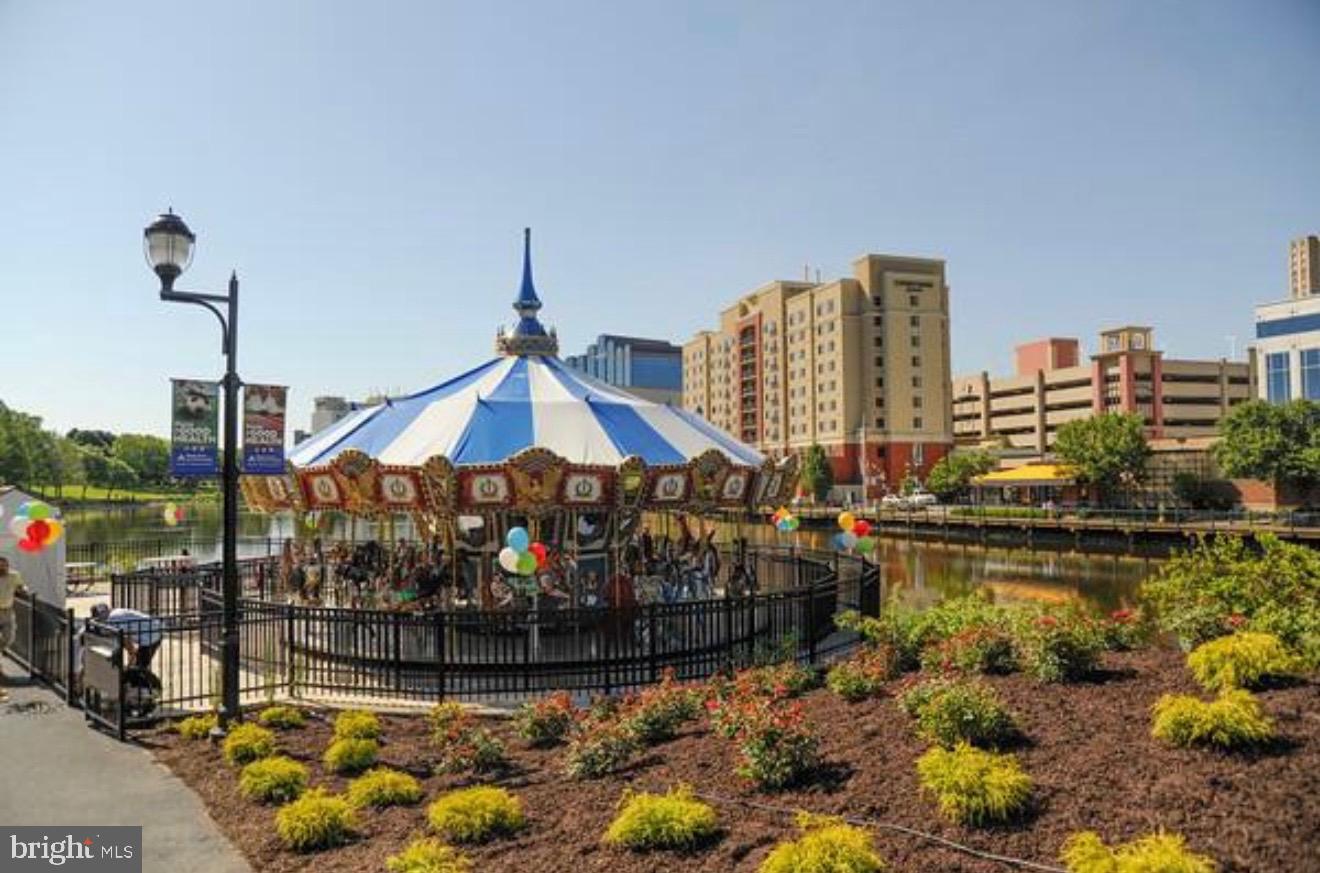 111 Timberbrook Lane, Unit 201 Gaithersburg, MD 20878 - Photo 38 of 38 a front view of a house with swimming pool and outdoor seating