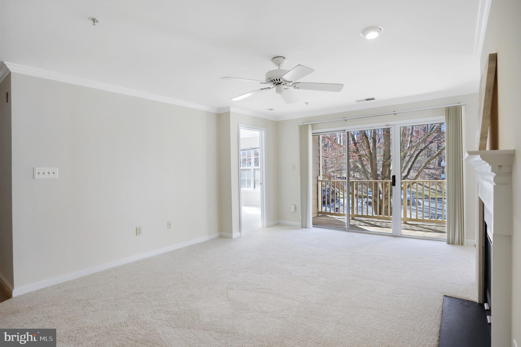 111 Timberbrook Lane, Unit 201 Gaithersburg, MD 20878 - Photo 9 of 38 a view of an empty room with a window