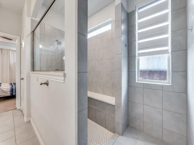 a bathroom with a glass shower door