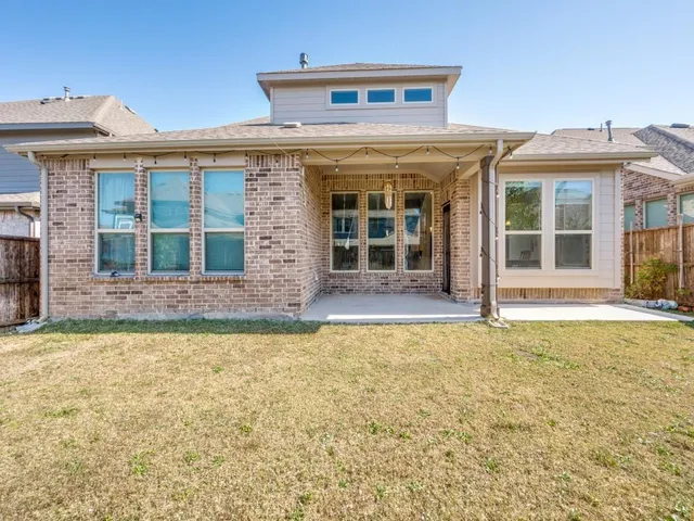 a view of a white house with a large windows