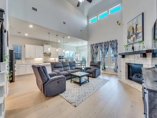 a living room with furniture and a fireplace
