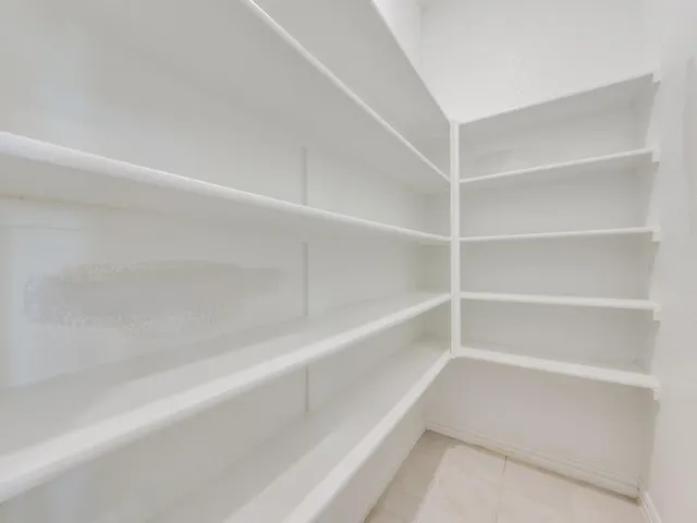 a view of an empty walk in closet