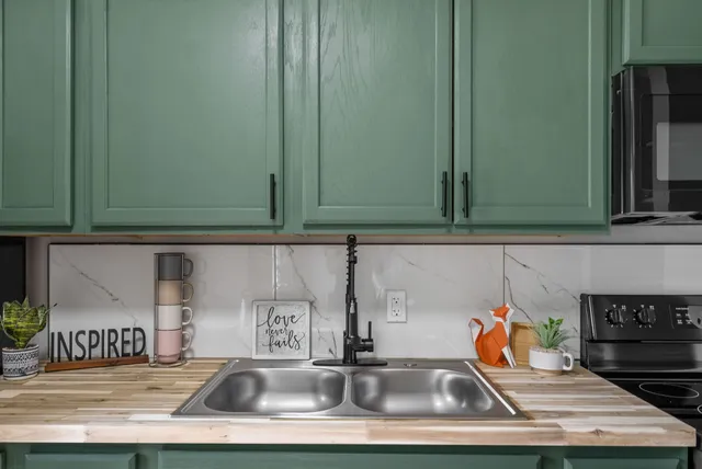 a kitchen with a sink and cabinets