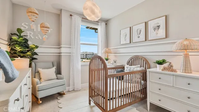 a bedroom with furniture and a window